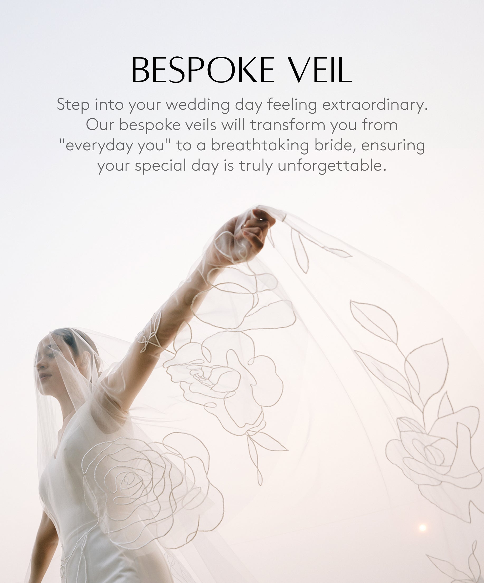 A woman holding up a white bridal veil with floral embroidery